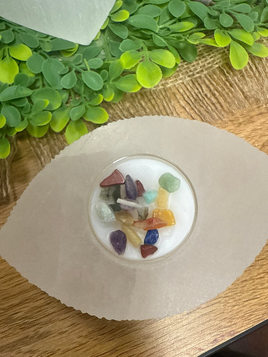 Base de ojo de selenita con vela de 7 chakras