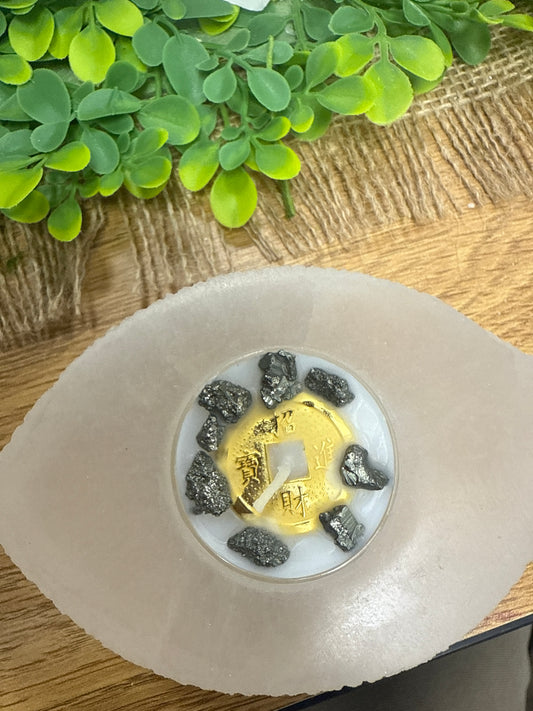 Base de ojo de selenita con vela de pirita